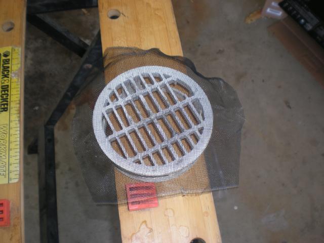 drain cover in garage with mesh